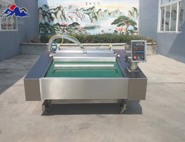 連續(xù)滾動(dòng)式真空包裝機(jī)?